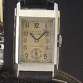 Rolex. A steel and gold rectangular wristwatch
