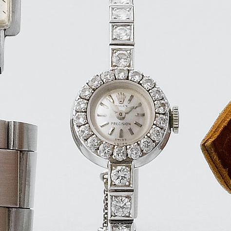 Rolex. A lady's white gold and diamonds bracelet watch