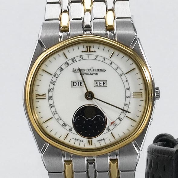 Jaeger Le Coultre. A steel and gold automatic triple calendar wristwatch