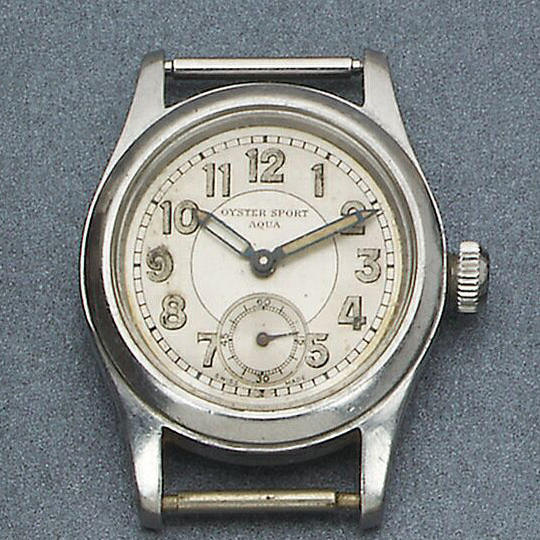 Rolex. A stainless steel manual wind wristwatch