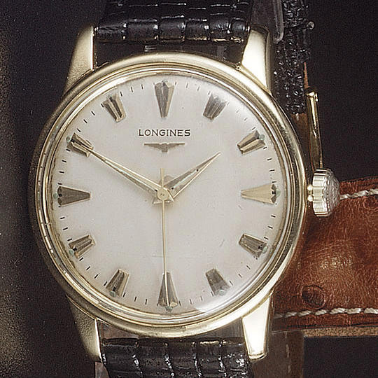 Longines. An 18ct gold automatic wristwatch with centre seconds