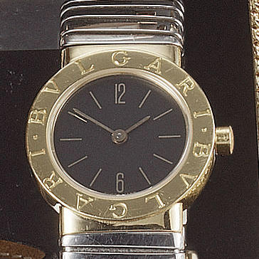 Bulgari. A lady's steel and 18ct gold bracelet watch