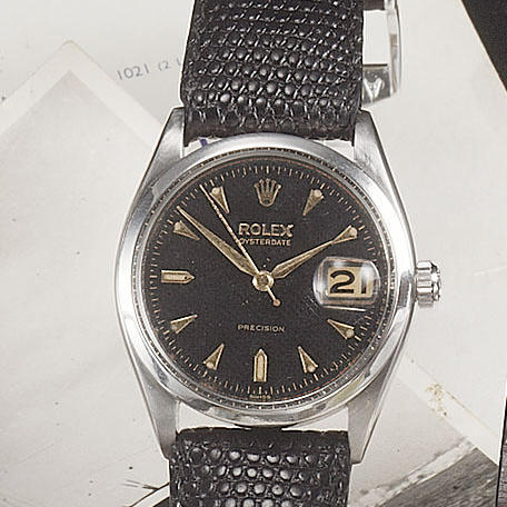 Rolex. A stainless steel manual wind wristwatch