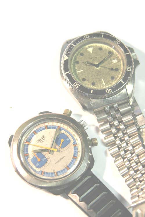 Two Heuer watches.
