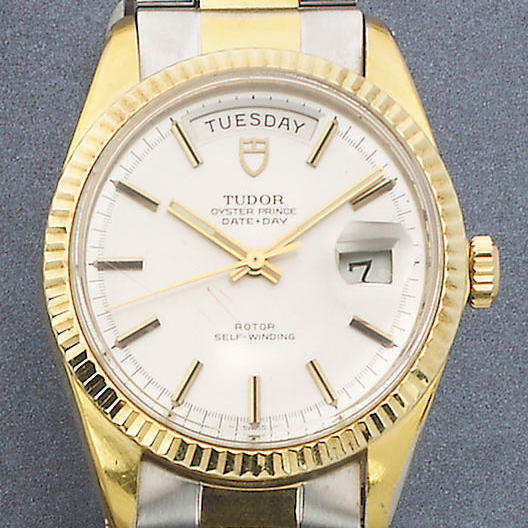 Rolex Tudor. A gents steel gilt metal automatic bracelet watch with day-date calendar