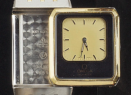 Omega. A gents steel and gilt reversible quartz bracelet watch