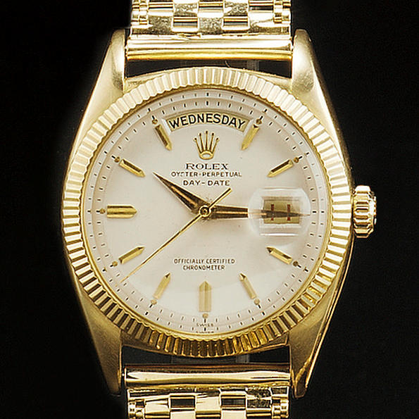 Rolex. A gents 18ct gold automatic centre seconds calendar wrist watch