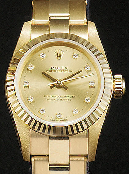 Rolex. A lady's 18ct gold centre seconds bracelet watch