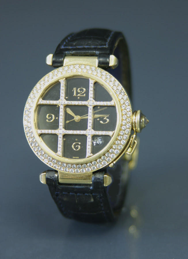 Cartier. A full size 18ct gold and diamond set automatic calendar wristwatch