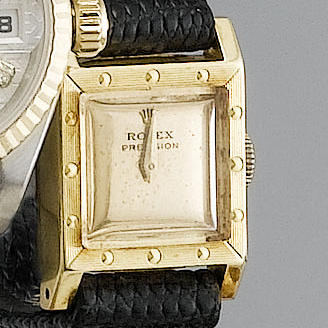 Rolex. A lady's 18ct gold square wristwatch