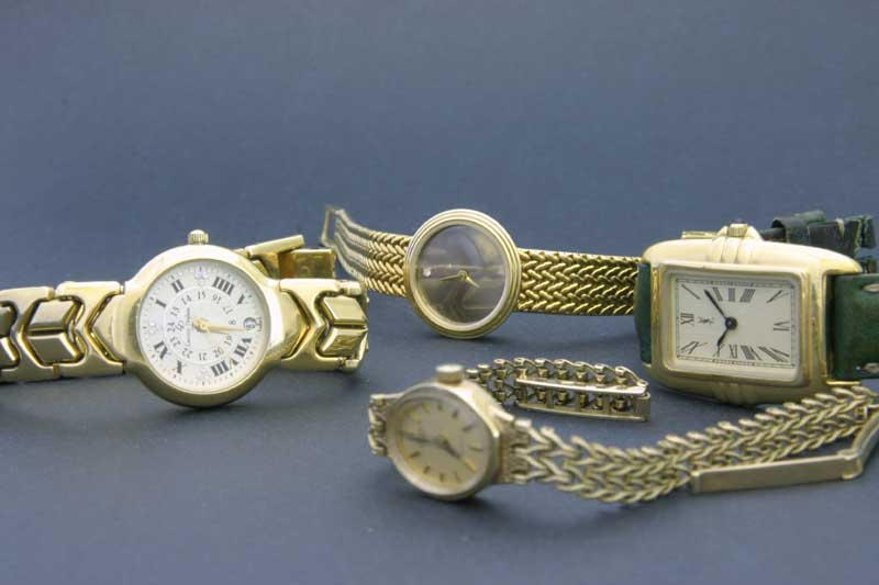 Four Lady's quartz wristwatches including YSL and an 18ct gold Omega
