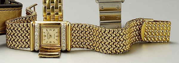 Rolex. A fine 18ct rose gold concealed dial bracelet watch