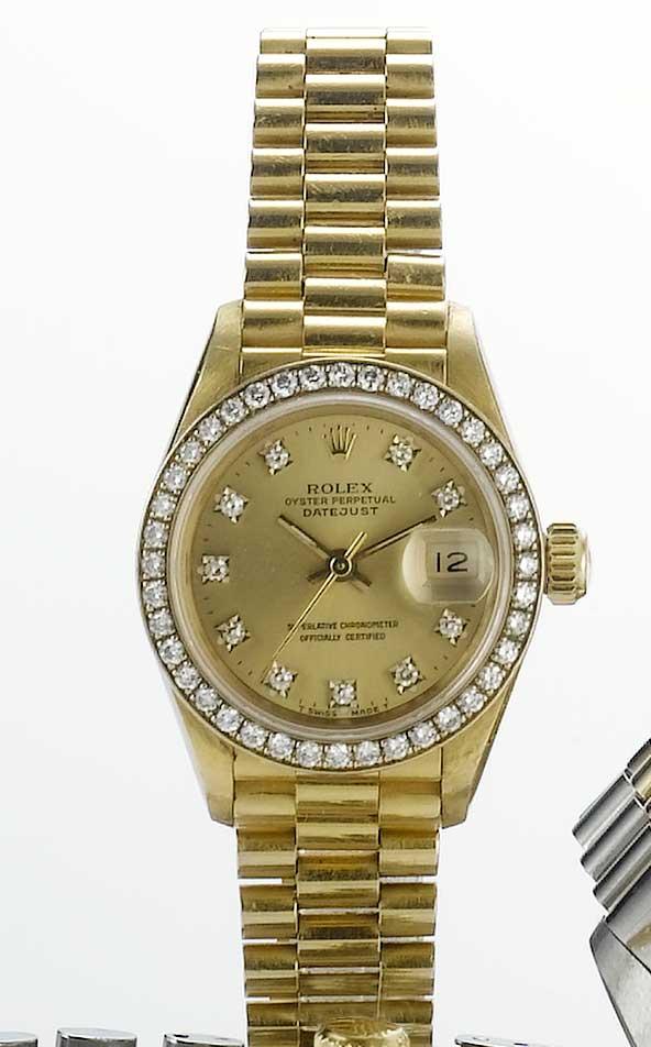 Rolex. An 18ct gold and diamond set automatic bracelet watch