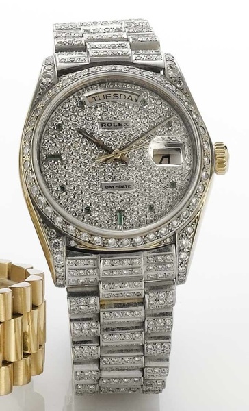 Rolex. An 18ct gold and later diamond set automatic calendar bracelet watch together with winding box