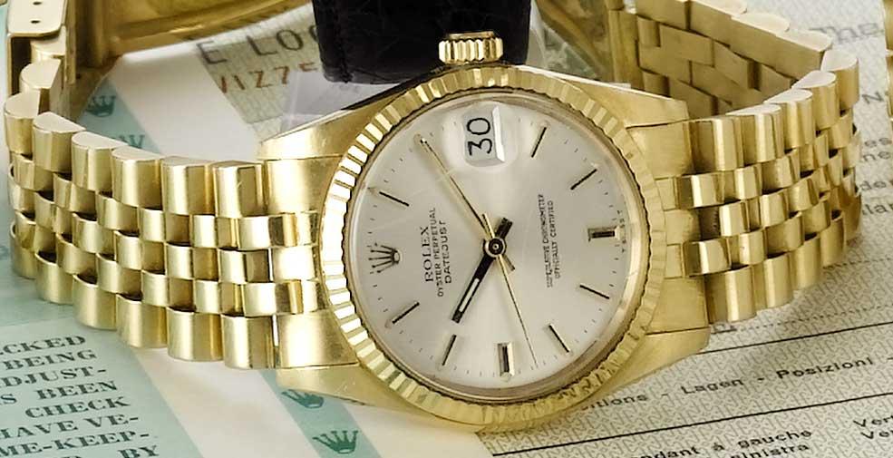 An 18ct gold mid-size bracelet watch with box and papers