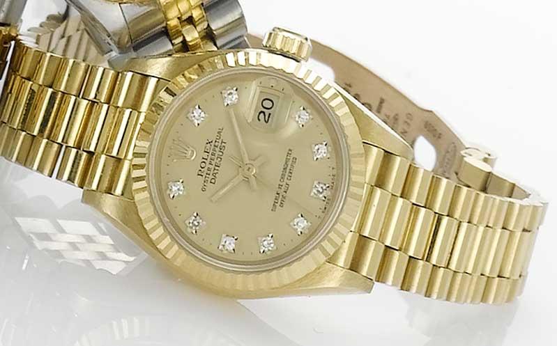Rolex. An 18ct gold automatic calendar bracelet watch with fitted box and papers