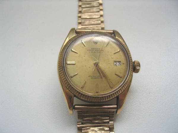 Rolex. An 18ct gold automatic centre seconds calendar watch