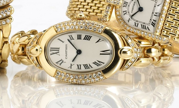 Cartier. A fine 18k gold and diamond set quartz bracelet watch
