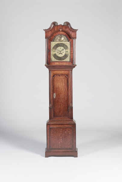 A late 18th century oak and mahogany longcase clock