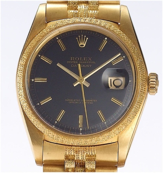 Rolex. An 18ct gold automatic black dial bracelet watch