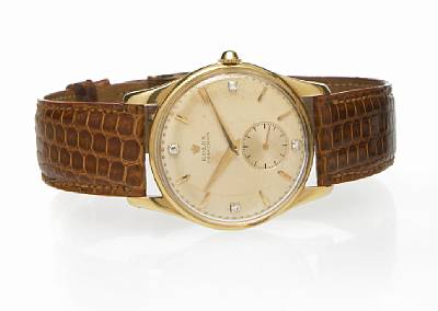 Rolex. A fine 18k gold wristwatch with diamond set dial