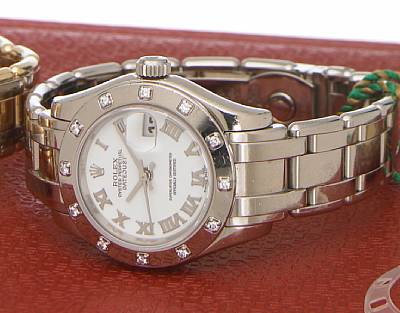 Rolex. A Lady's 18k white gold self-winding calendar bracelet watch with diamond set bezel