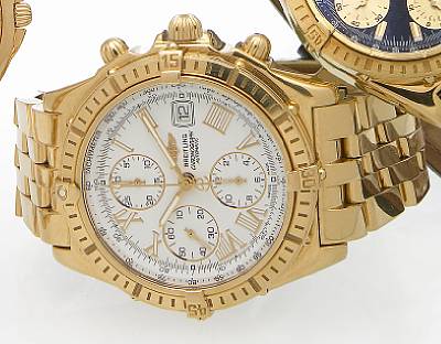 Breitling. An 18k gold self-winding chronograph bracelet watch with calendar