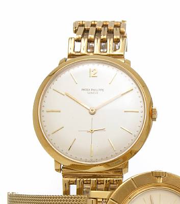 Patek Philippe. An 18k gold wristwatch with associated 18k gold bracelet