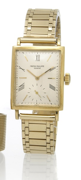 Patek Philippe. An 18k gold rectangular wristwatch with associated 14k gold bracelet
