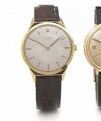 Patek Philippe. A 18k gold wristwatch with faceted shoulders