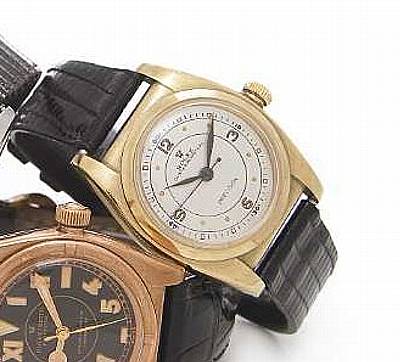 Rolex. A 9k gold center seconds wristwatch