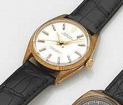 Rolex. A 9k gold self-winding wristwatch