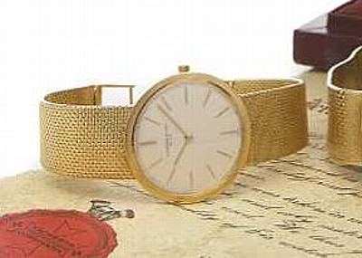 Vacheron Constantin. An 18k gold slim circular cased bracelet watch