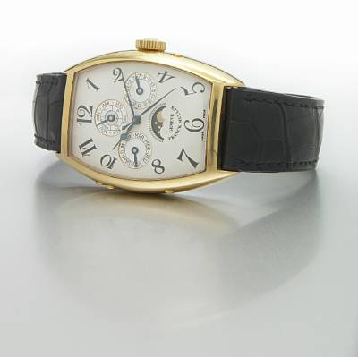 Franck Muller. A large tonneau-shape 18k gold self-winding perpetual calendar wristwatch with leap-year indication
