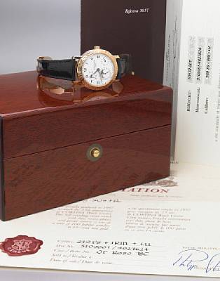 Patek Philippe. A fine and rare 18k rose gold limited edition moon-phase calendar wristwatch with 48 hour power reserve indicator