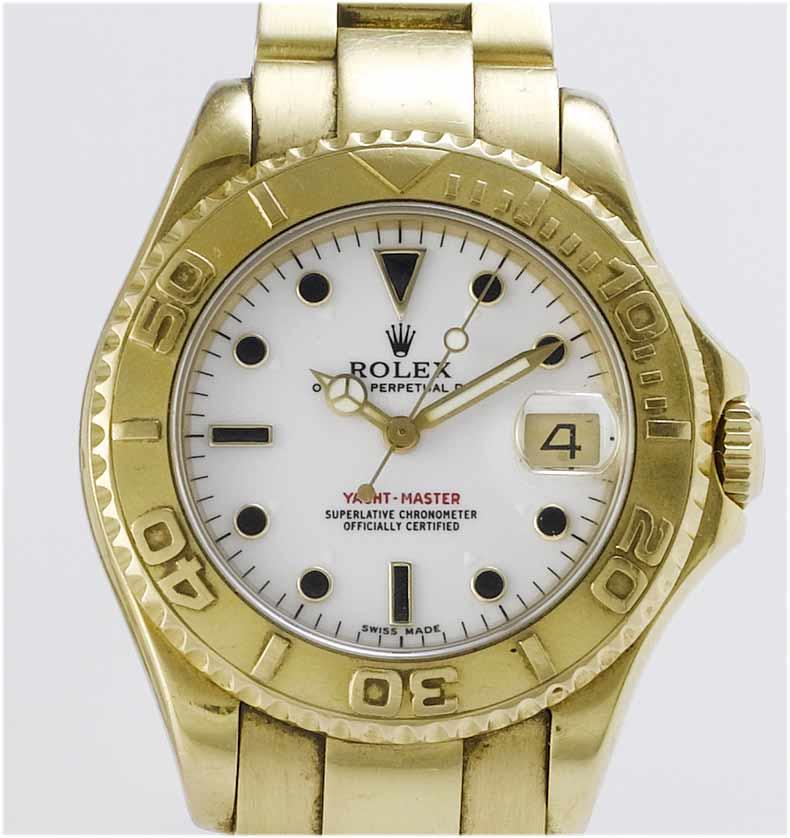 Rolex. A lady's 18ct gold centre seconds calendar bracelet watch