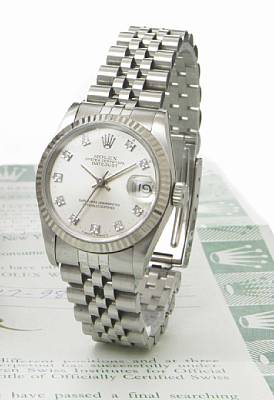 Rolex. A mid-size stainless steel self-winding calendar bracelet watch with diamond set dial