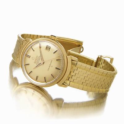 Omega. A fine and rare 18k gold self-winding calendar bracelet watch