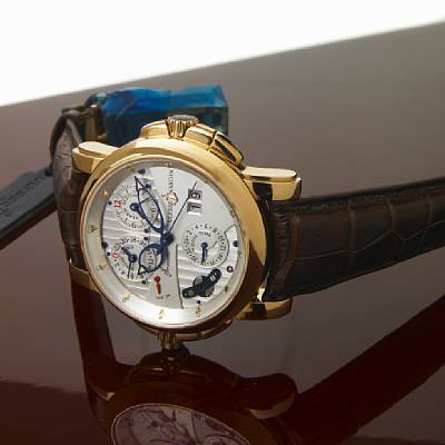 Ulysse Nardin. A fine and unusual 18k pink gold self-winding alarm wristwatch with dual time-zone, calendar and count-down timer