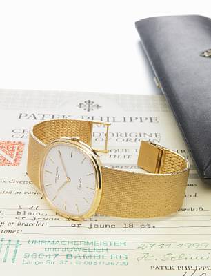 Patek Philippe. A very fine large 18k cushion cased quartz bracelet watch with original certificate and Patek Philippe presentation case