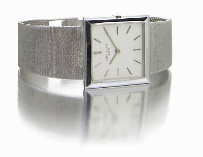 Patek Philippe. An 18k white gold square cased bracelet watch