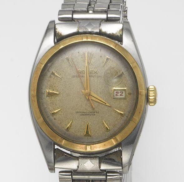 Rolex. A stainless steel and gold automatic centre seconds calendar bracelet watch