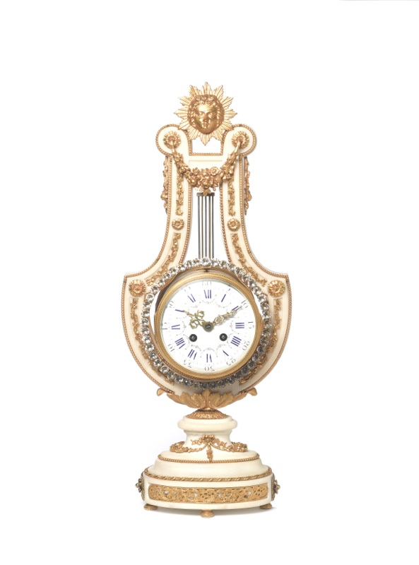 A mid to late 19th century French lyre mantel clock with swinging bezel