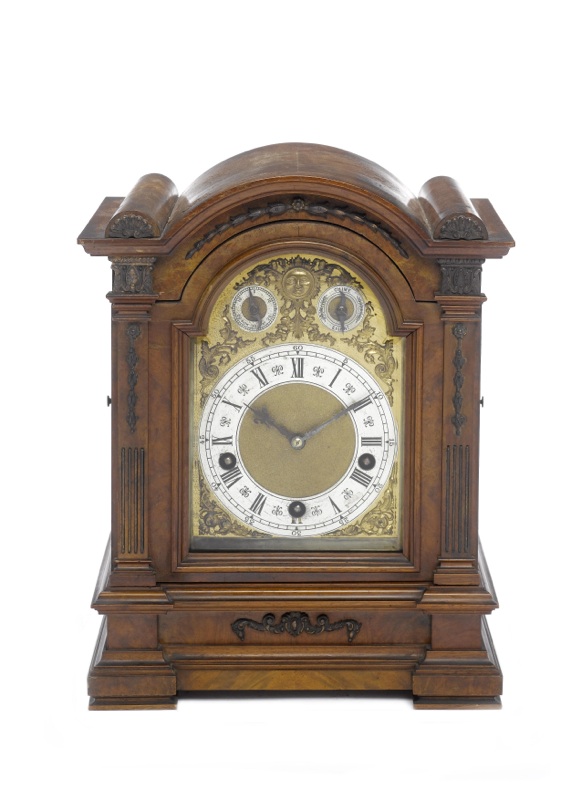 An early 20th century German quarter chiming walnut mantel clock
