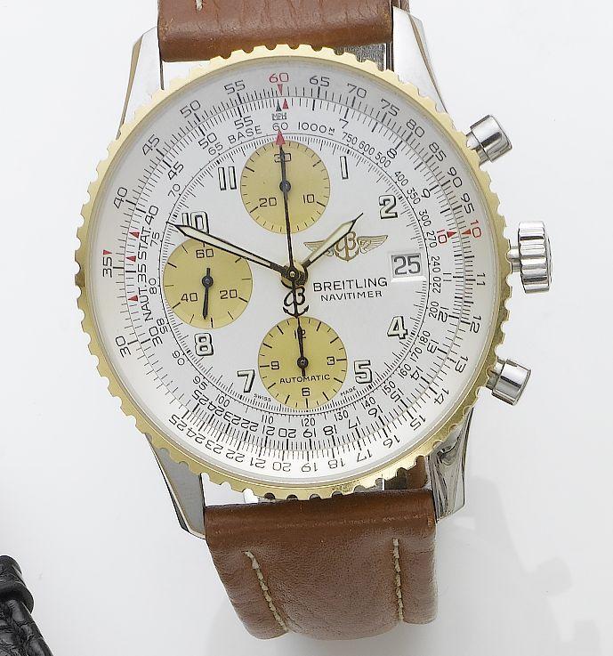 Breitling. A stainless steel and gold calendar chronograph wristwatch
