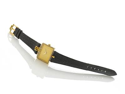 Corum. A fine lady's 18k gold diamond set wristwatch