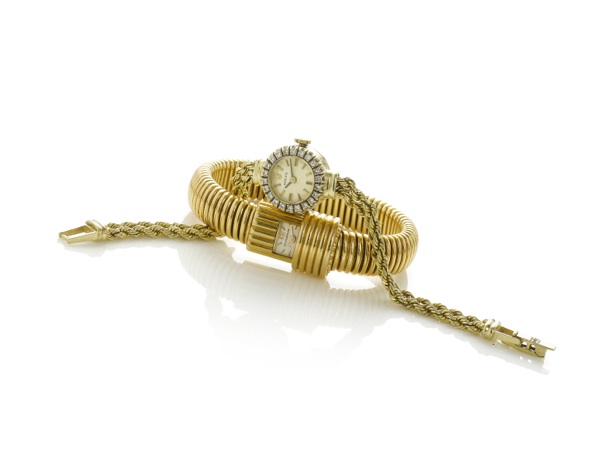 Rolex. A fine lady's 14k gold diamond set cocktail watch