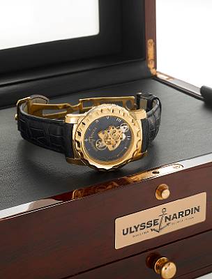 Ulysse Nardin. A very fine and unusual limited edition 18k rose gold 7 day Carrousel-Tourbillon wristwatch with 60 minute revolving movement, Ludwig Oechslin's dual direct escapement, seven day power reserve, together with fitted presentation box and pape