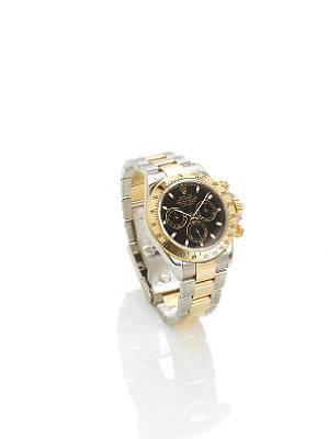 Rolex. A fine stainless steel and gold automatic chronograph bracelet watch