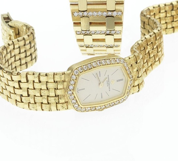 Vacheron Constantin. A fine and rare lady's 18ct gold diamond set weave link bracelet watch